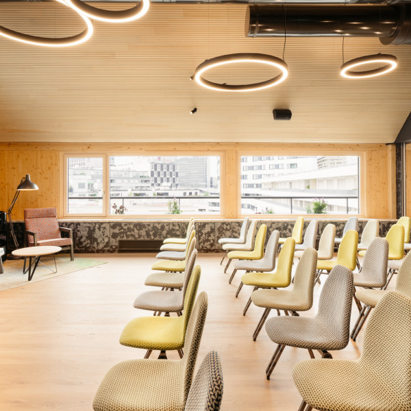 Seminar room with a large screen in the rooftop event space at Hotel Schani Wien